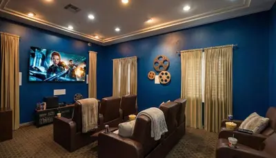 a waiting room with chairs and a flat screen tv at 1BR Luxury Apartment - Luxury Resort Amenities in Los Angeles