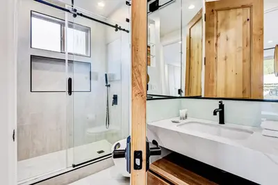 a bathroom with a sink and a shower at Modern LA Villa 5BR Home with Private Pool & Yard in Los Angeles