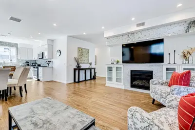 a living room with a fireplace and a tv at Modern 4BR Villa Spacious Stylish In Prime Location in Los Angeles