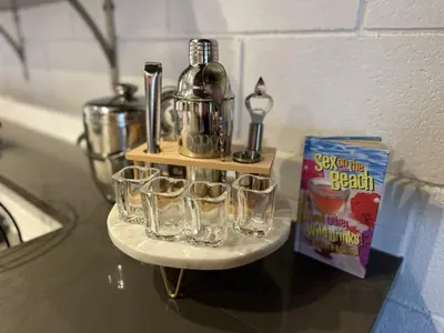 a tray of glasses sitting on a counter with a coffee maker at Ocean View Balcony, 4 Min Walk to Beach in Manhattan Beach