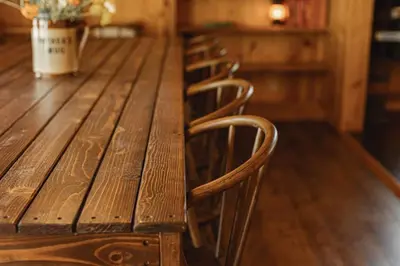 a row of chairs sitting at a wooden table at Lakeside Lodge - Deck Views, Golf, Basketball, Spa in Fawnskin