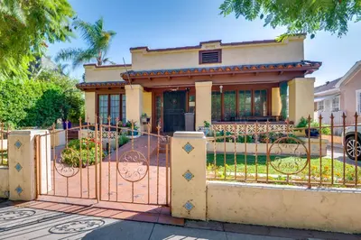 a gate in front of a house at Walk to Hollywood Blvd Chic LA Studio with Patio! in Los Angeles