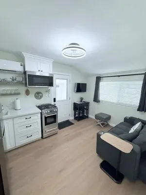 a living room with a couch and a kitchen at Private 1BR 1BA Suite, Kitchen, Fireplace, Parking in Simi Valley
