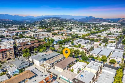 an aerial view of a city with a yellow arrow at Relax in Spacious 3BR Apt Sleeps 8 and Parking in Glendale