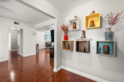 a living room with white walls and wooden floors at Spacious Family Retreat in San Dimas Great Location in Covina