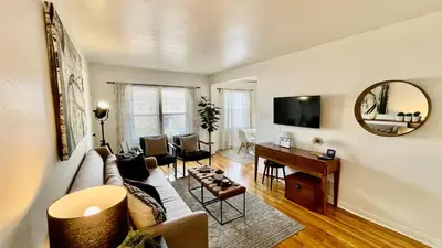 a living room with a couch and a table at Remodeled Bixby Knolls 2 bedroom unit - Close to shopping in Long Beach