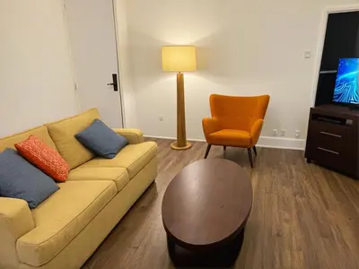 a living room with a couch and a chair at Stylish Venice Escape Near the Marina & Beachfront in Los Angeles