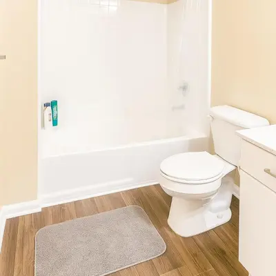a bathroom with a white toilet and a bath tub at Cozy Home Close to Disney in Orange