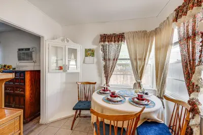 a dining room with a table and chairs and a window at High Walkability! Extended Stay in Riverside in Riverside