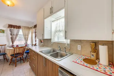 a kitchen with a sink and a counter top at High Walkability! Extended Stay in Riverside in Riverside