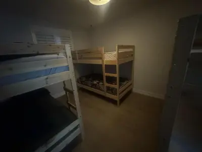 a bedroom with two bunk beds in a room at Soulistic Vibes Normandie in Los Angeles
