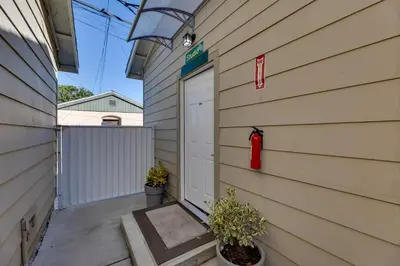 a garage with a red fire hydrant on the side of a house at 4 Mi to Old Pasadena Walkable Studio in Alhambra