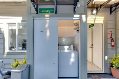 a garage with a refrigerator and a laundry room at Walk to Main St! Pet-Friendly Alhambra Studio in Alhambra