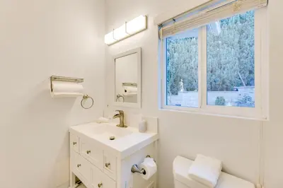 a white bathroom with a sink and a window at 2 Blocks to Main St Foodies Paradise in Alhambra in Alhambra