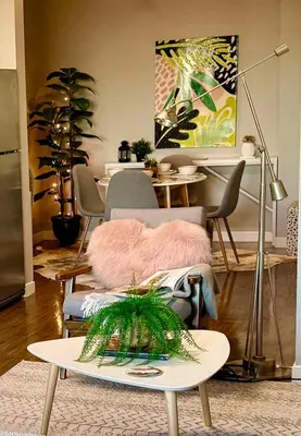a living room with a couch and a table at Stylish Studio in Mid-Wilshire with Pool, Free Parking, Gym in Prime Location in Los Angeles