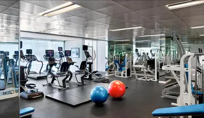 a gym with treadmills and exercise bikes and balls at Santa Monica Ocenfront 2 Bedroom Villa with Parking in Los Angeles