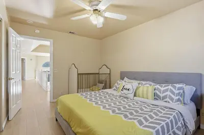 a bedroom with a bed and a ceiling fan at Spacious Mountain Getaway Game Room & Gazebo villa in Pine Mountain Club