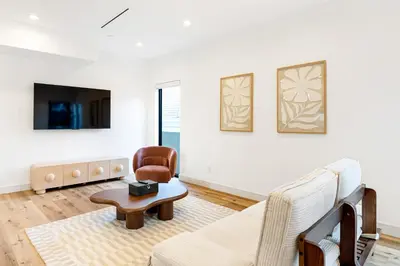 a living room with a couch and a chair at Metro Loft LA in Los Angeles