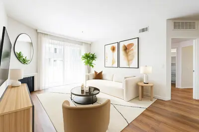 a living room with a couch and a table at 1BR Apartment in Marina del Rey - Near Venice Beach, Pool, Gym, Sauna, Hot Tub, EV Charging in Los Angeles