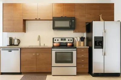 a kitchen with a stove and a refrigerator at 1BR Apartment in Marina del Rey - Near Venice Beach, Pool, Gym, Sauna, Hot Tub, EV Charging in Los Angeles