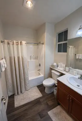 a bathroom with a toilet and a tub and a sink at Relaxed Marina del Rey Stay - 1BR with Pool, Sauna & Gym Access in Los Angeles