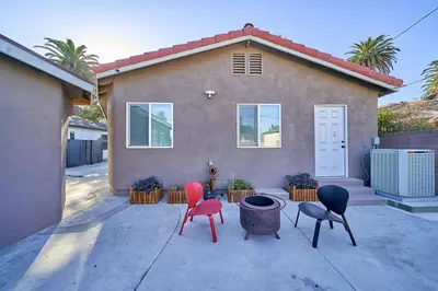 a house with four chairs in front of it at 4 bedrooms in Long Beach