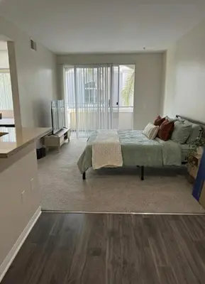 a bedroom with a bed and a large window at Marina Del Rey 2BR & 1BR Getaway - Gym - Pool - Sauna - Near Marina - Venice Beach in Los Angeles