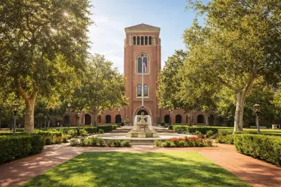 a building with a clock tower and a fountain at Modern 3BR Home Near USC, Museums & Coliseum in Los Angeles
