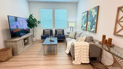 a living room with a couch and a tv at Modern Luxury House 3B&4B House 30 mins DTLA in Baldwin Park