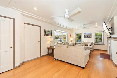 a living room with a couch and a ceiling fan at The SOFI Special - Modern Retreat, Dog Friendly in Los Angeles