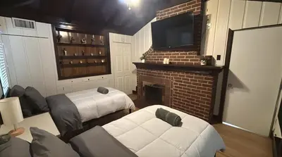 a living room with a fireplace and a tv at The SOFI Special - Modern Retreat, Dog Friendly in Los Angeles