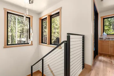 a staircase in a house with windows at 34 - The Maple Crest home in Big Bear Lake