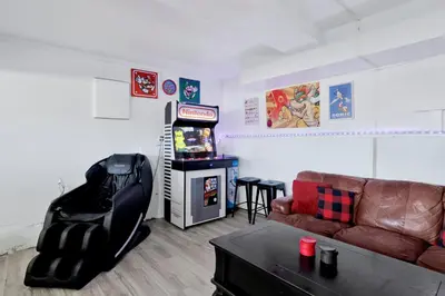 a living room with a couch and a video game at Lakeview Pines Log Cabin #2585 in Big Bear Lake