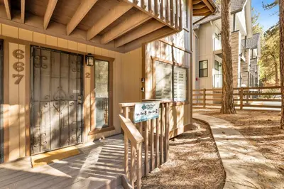 a front door of a house with a sign on it at Summit Ski and Bike Trails #2574 in Big Bear Lake