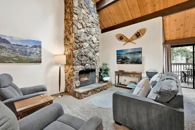 a living room with a couch and a fireplace at Switzerland Summit Condo #2569 in Big Bear Lake