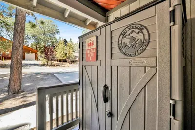 a wooden garage door with a sign on it at Golden West Cottage #2581 in Big Bear Lake