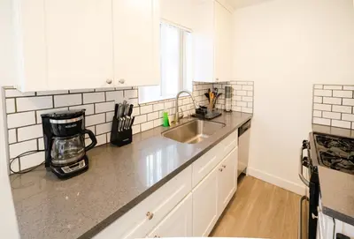 a kitchen with a sink and a counter top at Cozy 2 Bedroom In Hollwood area Close to Downtown La in Los Angeles