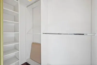 a walk in closet with a white door and shelves at Darling 2 bedroom 1 bathroom Highland Park Home with Jacuzzi and View in Los Angeles
