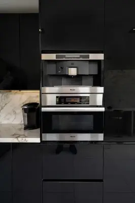 a kitchen with a stainless steel oven in a counter at Sunset Plaza Ultra Modern Home in Los Angeles