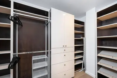 a walk in closet with a glass door at Sunset Plaza Ultra Modern Home in Los Angeles