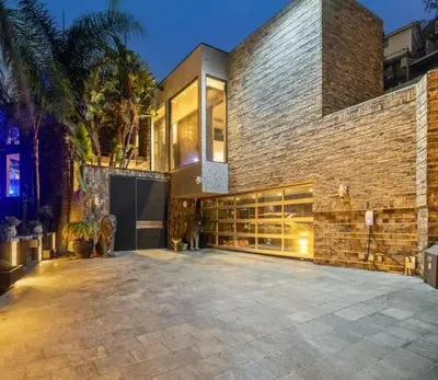 a brick house with a large patio at Bali Inspired Villa in Sunset Plaza in Los Angeles