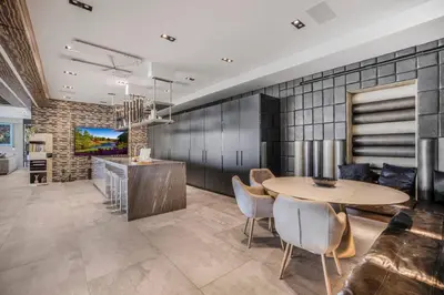 a dining room and kitchen with a table and chairs at Bali Inspired Villa in Sunset Plaza in Los Angeles