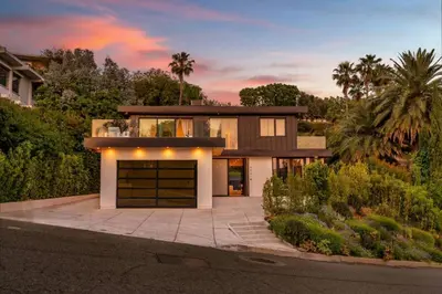 a house with a garage on a street at Luxury 6BR Beverly Hills Villa with Pool and Views in Los Angeles