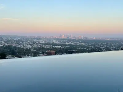 a view of a city from the top of a building at Serene Glasshouse Retreat with Iconic LA Skyline Views in Los Angeles