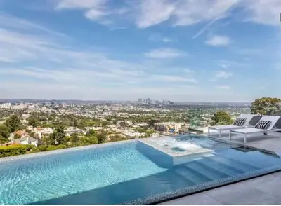 a swimming pool on the roof of a house at Serene Glasshouse Retreat with Iconic LA Skyline Views in Los Angeles