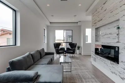 a living room with a couch and a fireplace at Luxury Modern 4 Bed 4 Bath Home with Rooftop Deck #6 in Los Angeles