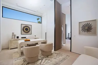 a dining room with a table and some chairs at Ultra-Luxurious BH Estate with Pool, Theatre, Views in Beverly Hills