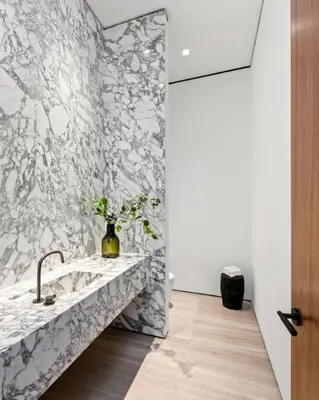 a bathroom with a sink and a wall mural at Luxurious 5BR Villa in BH with Pool, Theater, and Views in Los Angeles