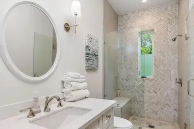 a white bathroom with a sink and a mirror at Summitridge Bev Hills Villa with Pool, Spa, Roof Deck in Beverly Hills