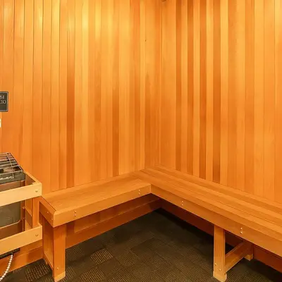 a bench in a room with wooden walls at Holiday in LA- Koreatown Retreat with Free Parking, Pool and Sauna in Los Angeles